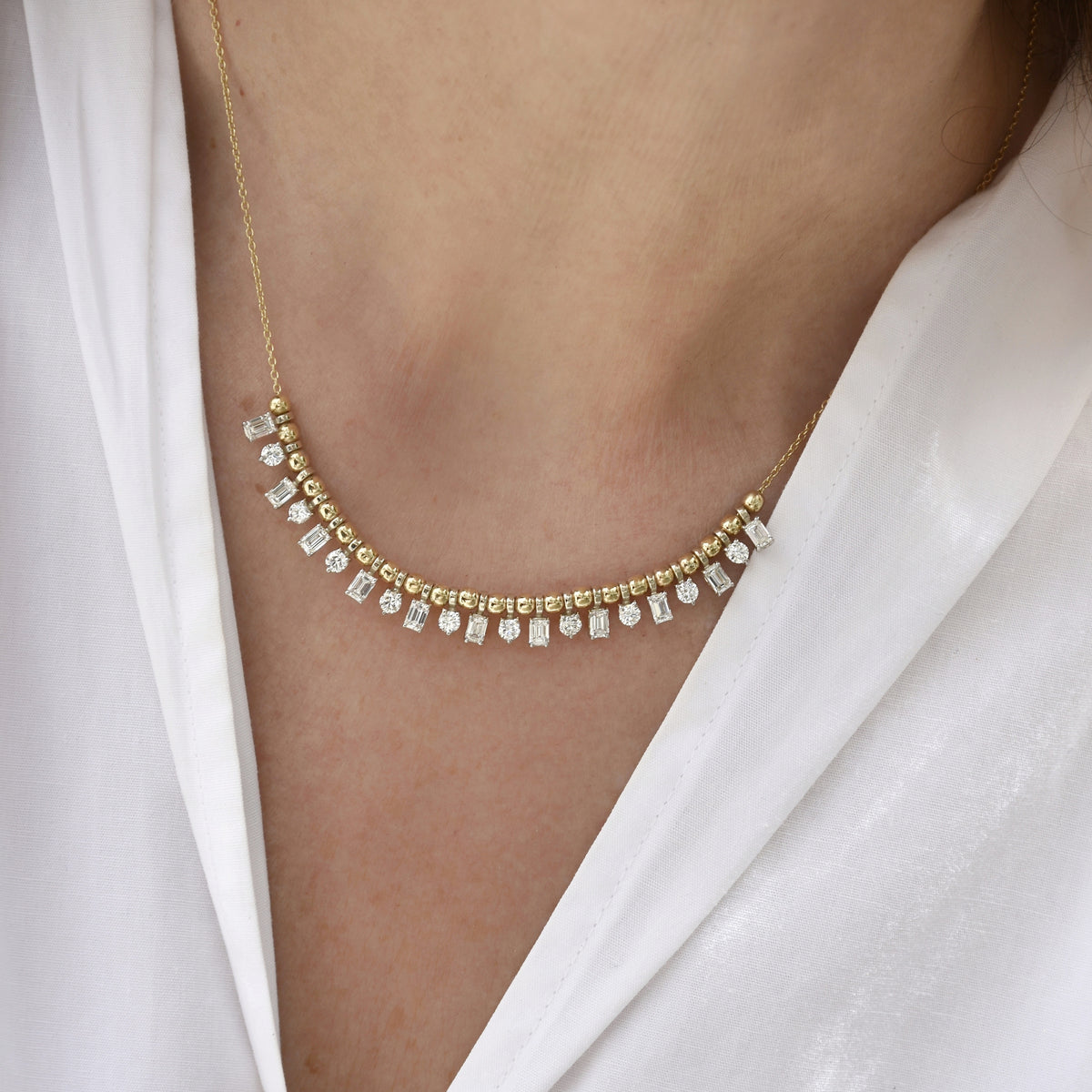 Bubbly necklace with emerald cut & round diamonds