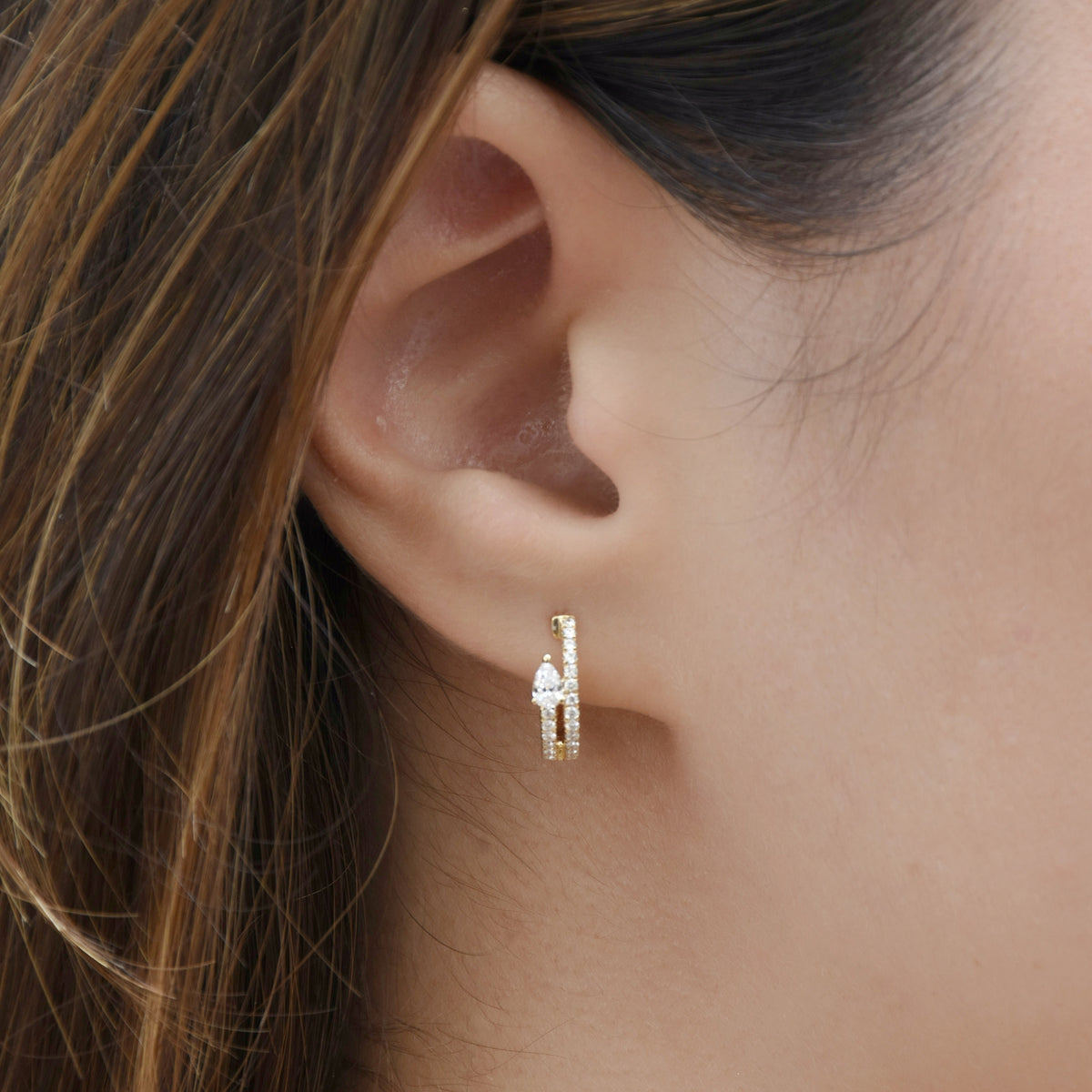 Double huggies with pear diamond