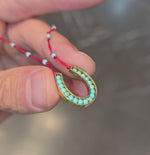 Load and play video in Gallery viewer, Knitted Horseshoe Necklace

