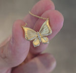 Load and play video in Gallery viewer, Gold-Brushed Butterfly Necklace
